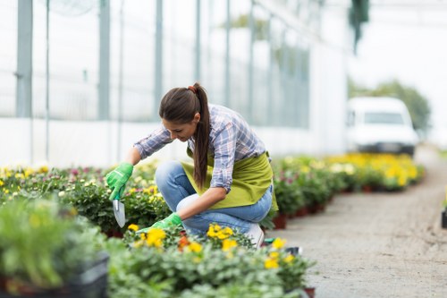 Gardener with safety helmet and insurance paperwork